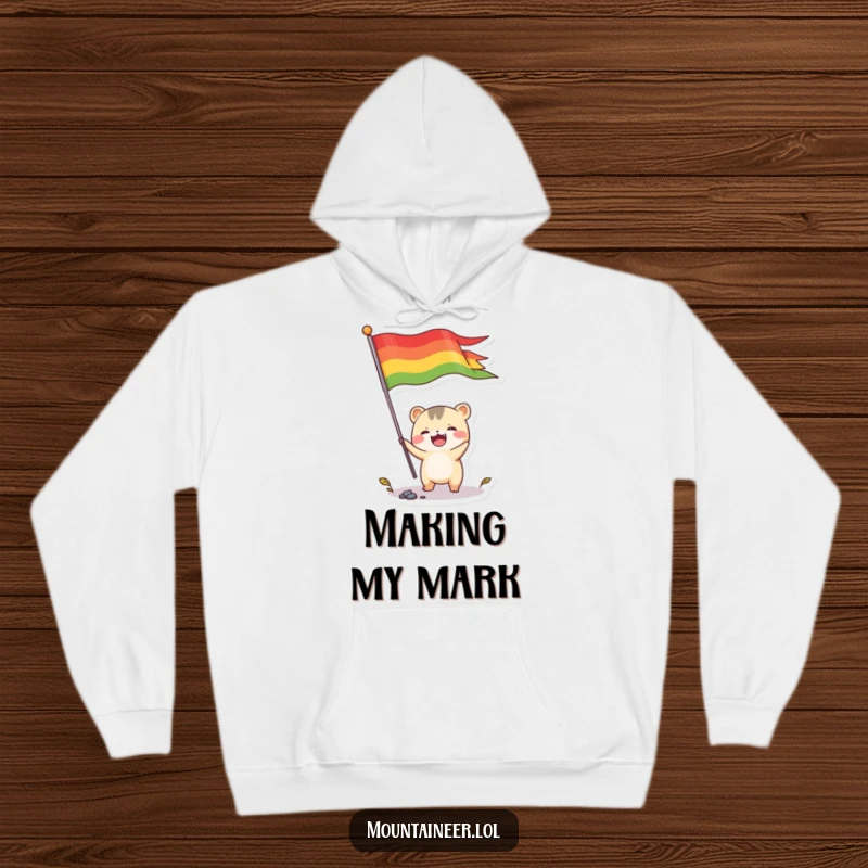 Funny hoodie depicting a small, energetic creature joyfully planting a colorful flag, designed for warmth and humorous celebration.